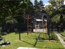 Арочный балочный навес во дворе